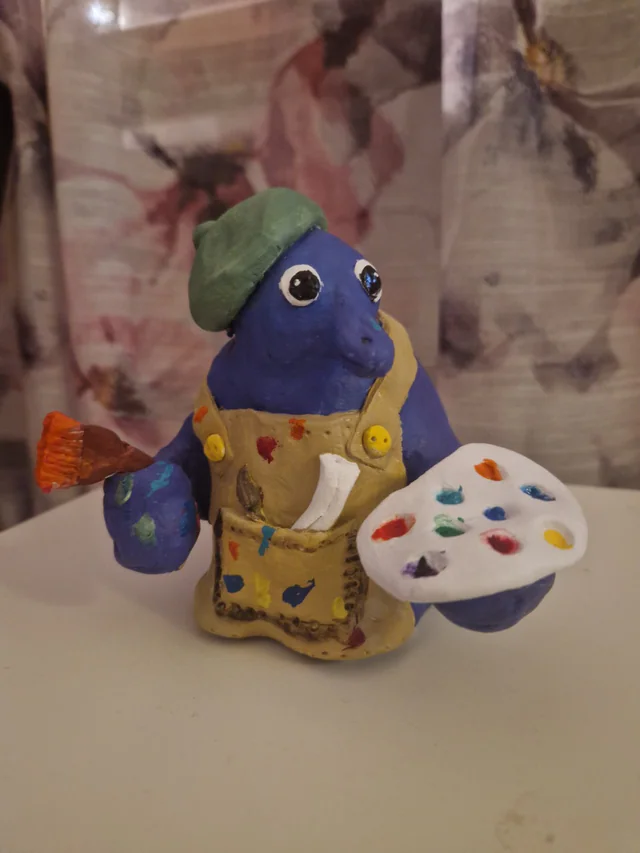 Målarkludde med pensel och färgpalett